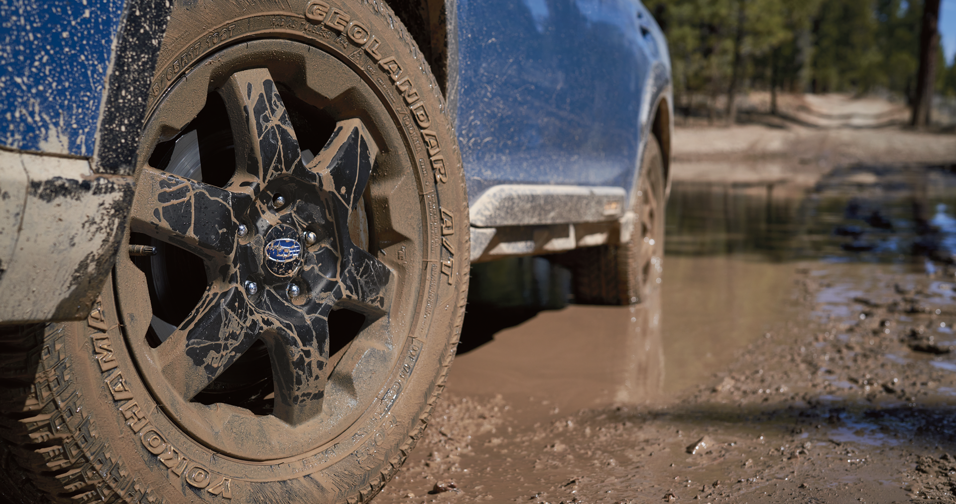 A close-up of the 17-inch off-road wheels and all-terrain Yokohama GEOLANDAR® tires on the 2023 Outback Wilderness. | Dalton Subaru in National City CA