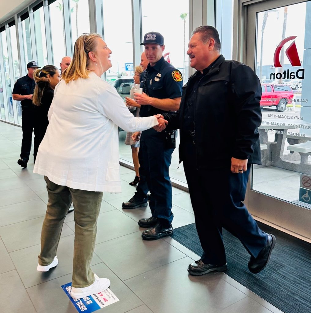 GSM Lori Hofman greeting Police Chief Tellez