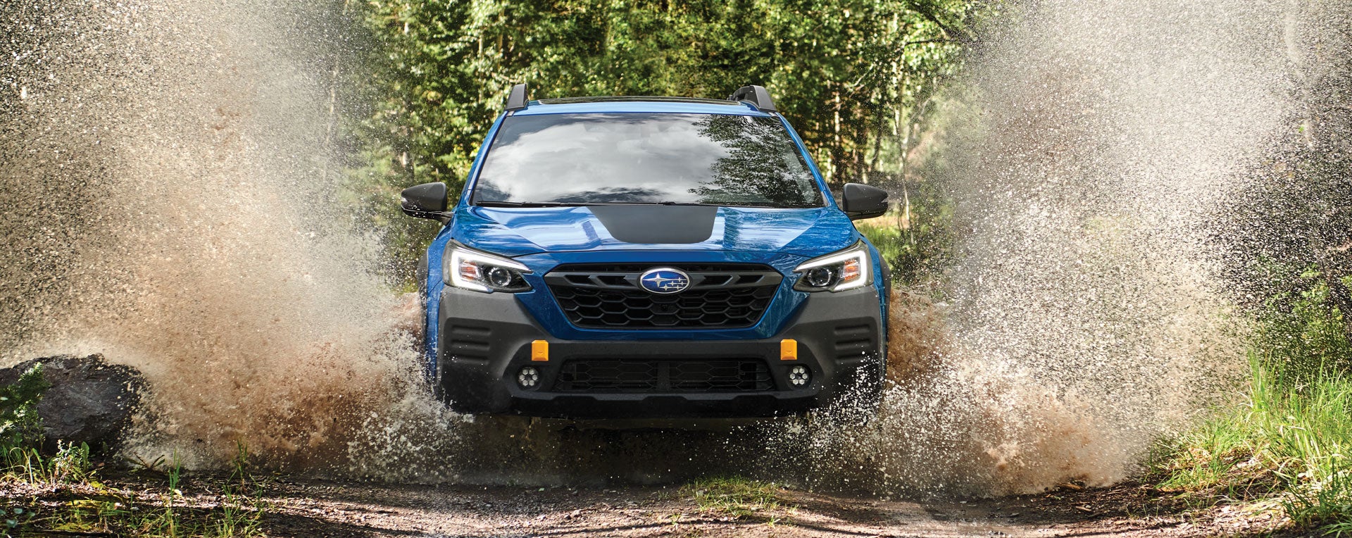 A 2023 Outback Wilderness driving on a muddy trail. | Dalton Subaru in National City CA