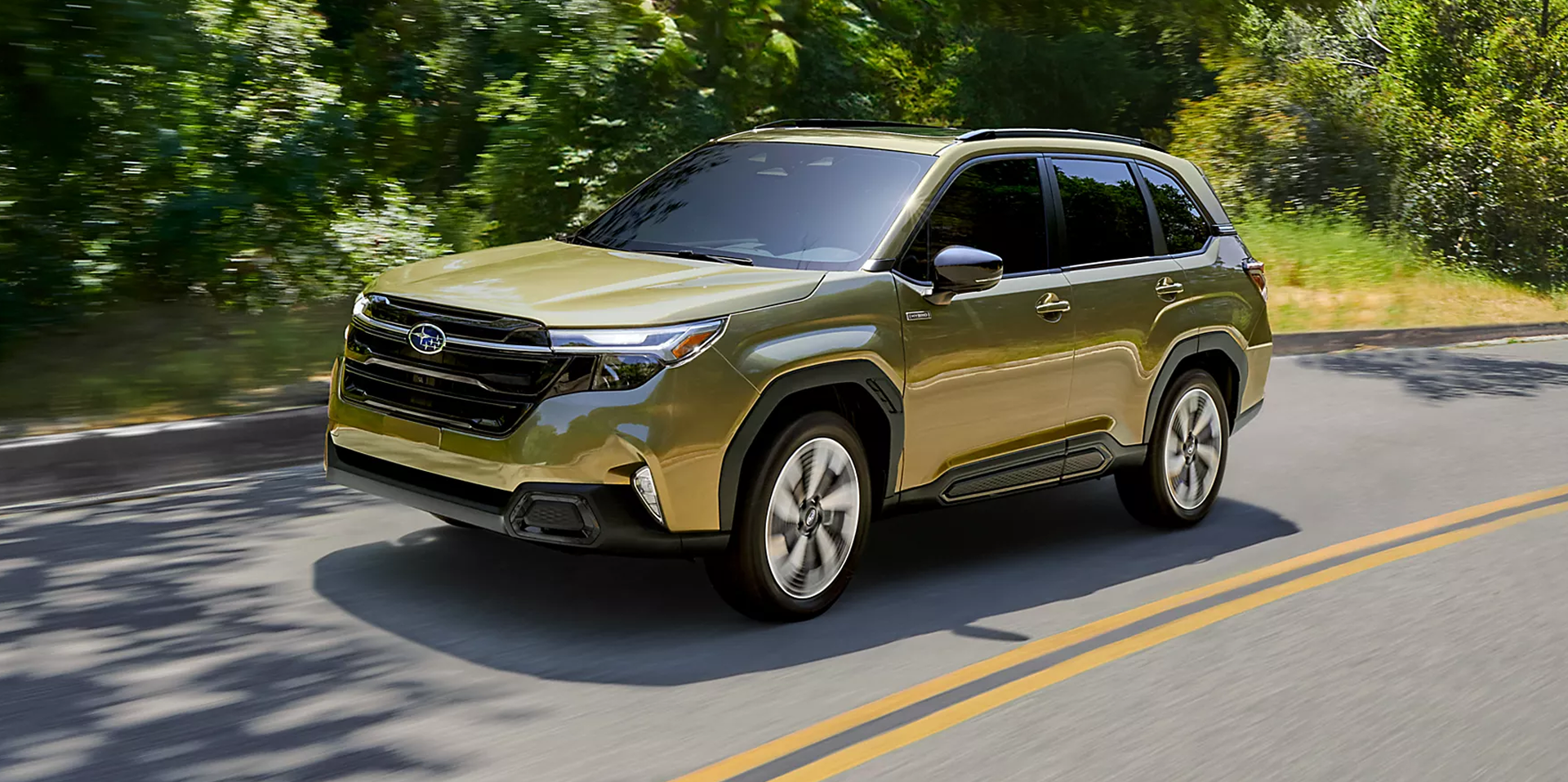 2026 Subaru Forester Hybrid driving on a scenic road