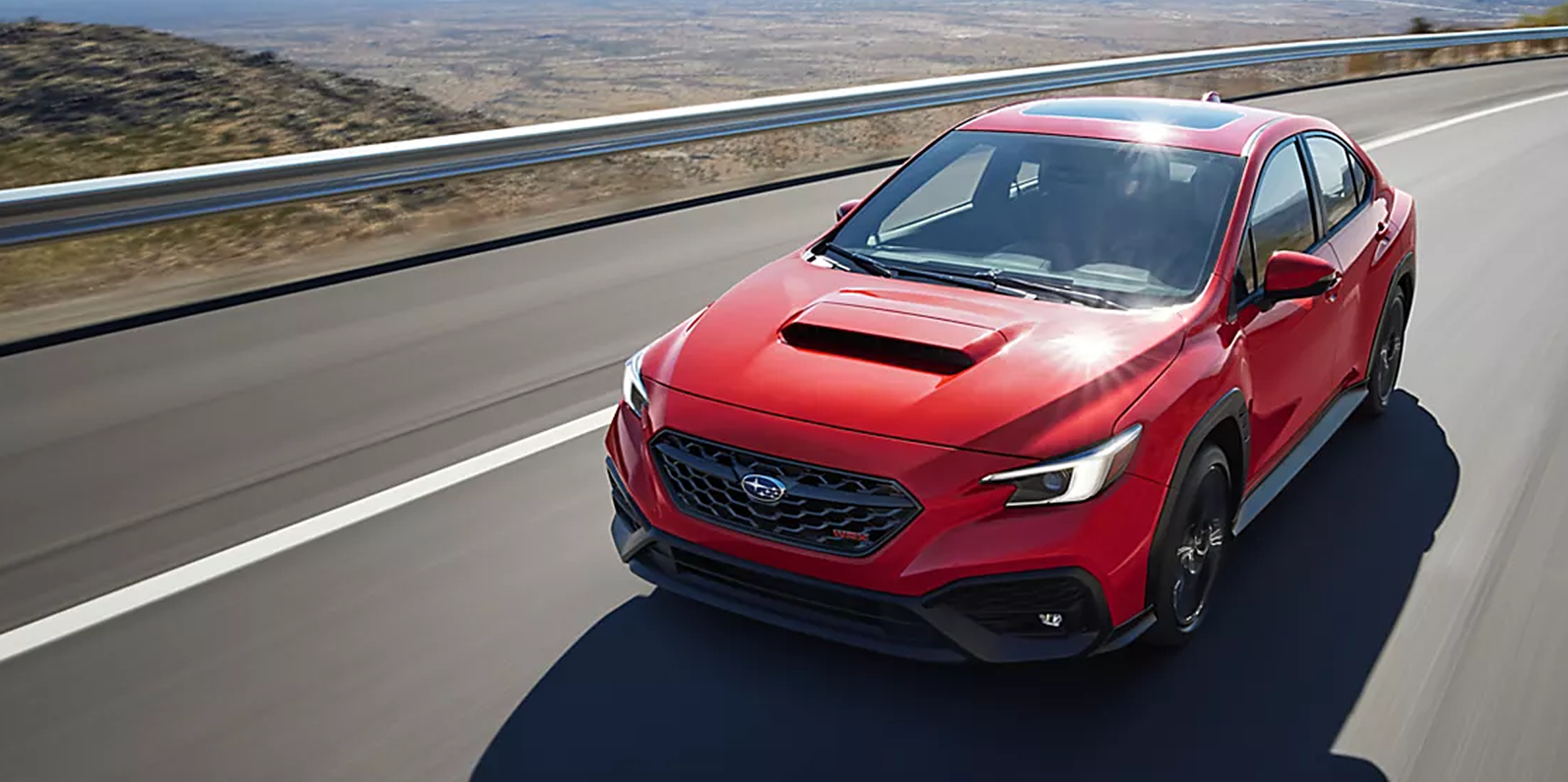 2026 Subaru WRX driving on a desert highway