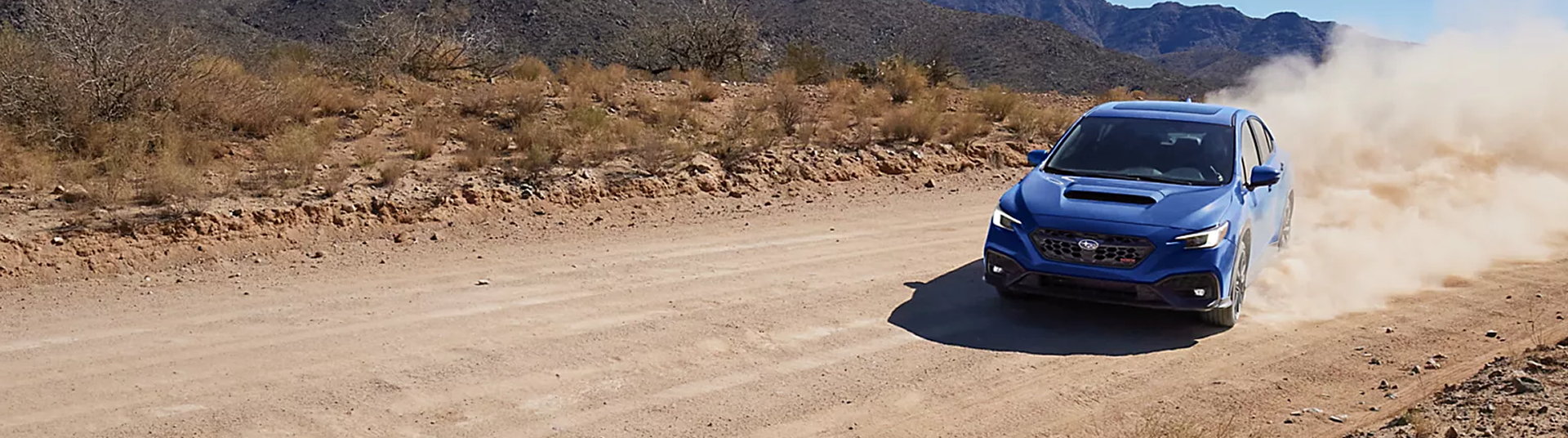 WRX racing through rugged terrain