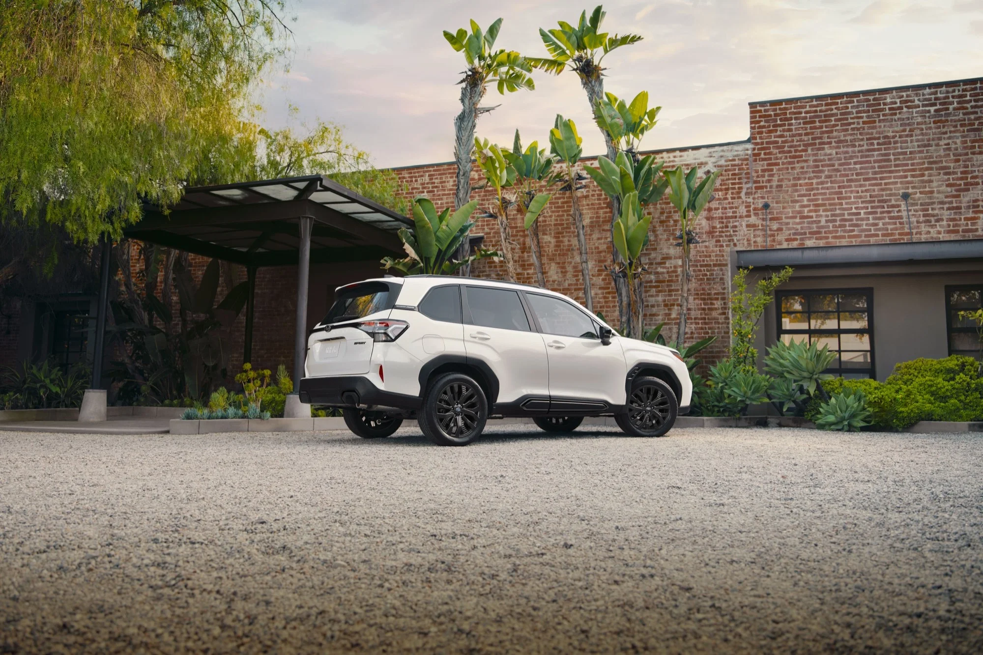 A white 2026 Subaru Forester Sport parked in a courtyard, the kind of everyday Subaru Dalton Subaru National City buyers choose the brand for
