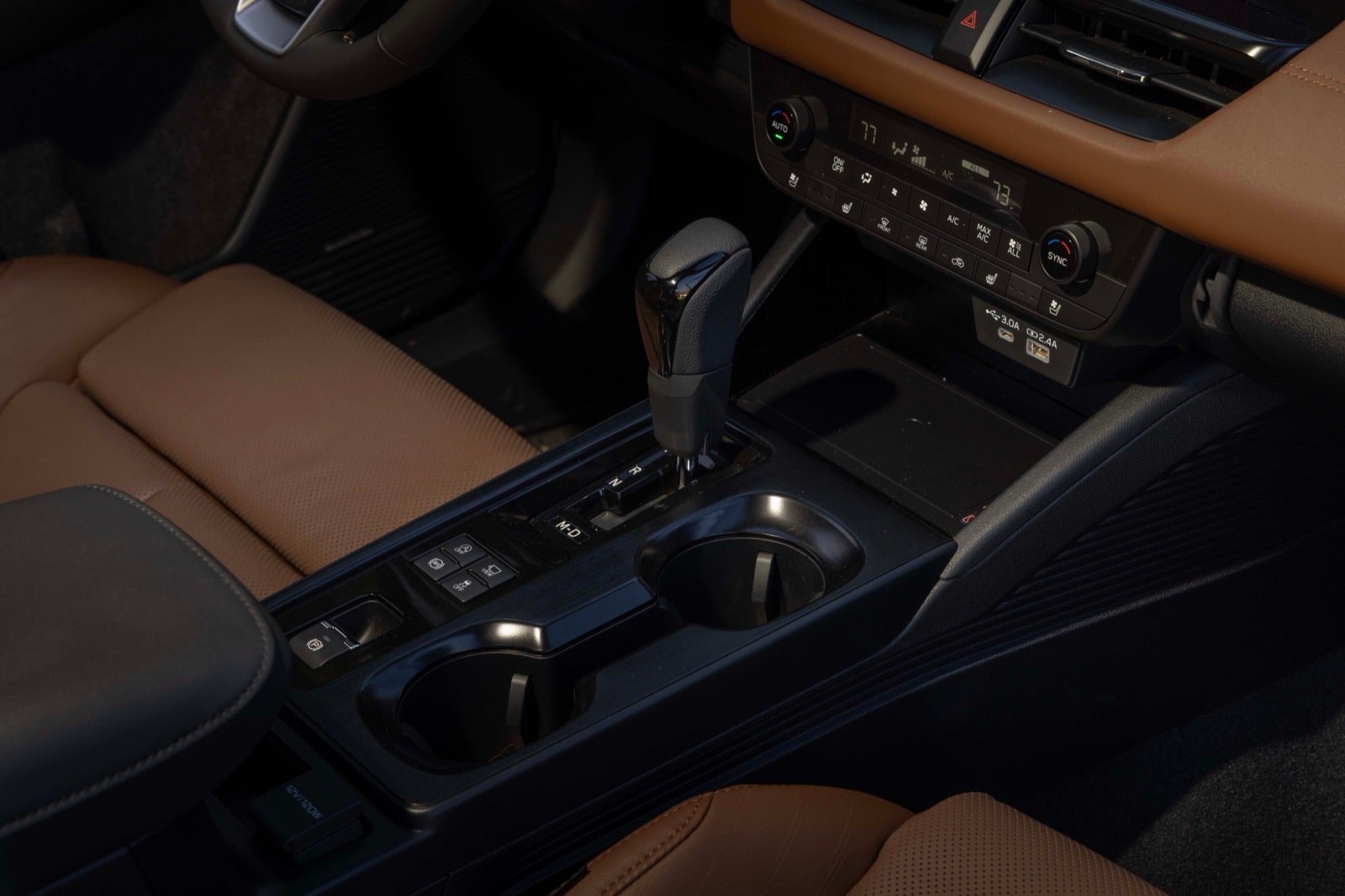 Center console and shifter of a 2026 Outback with brown leather trim.