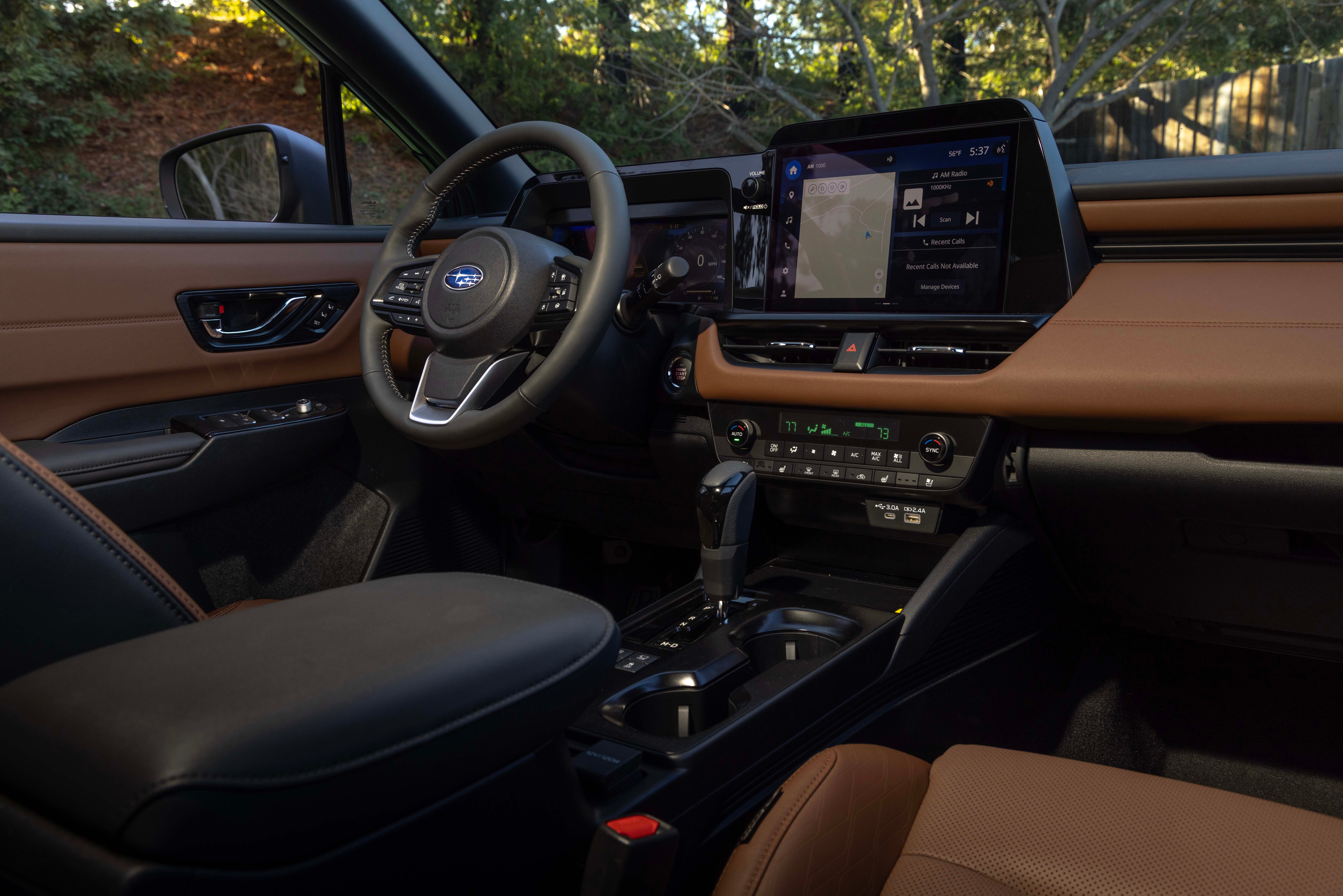 The Subaru Outback cabin seen from the passenger side, showing the steering wheel, touchscreen and console