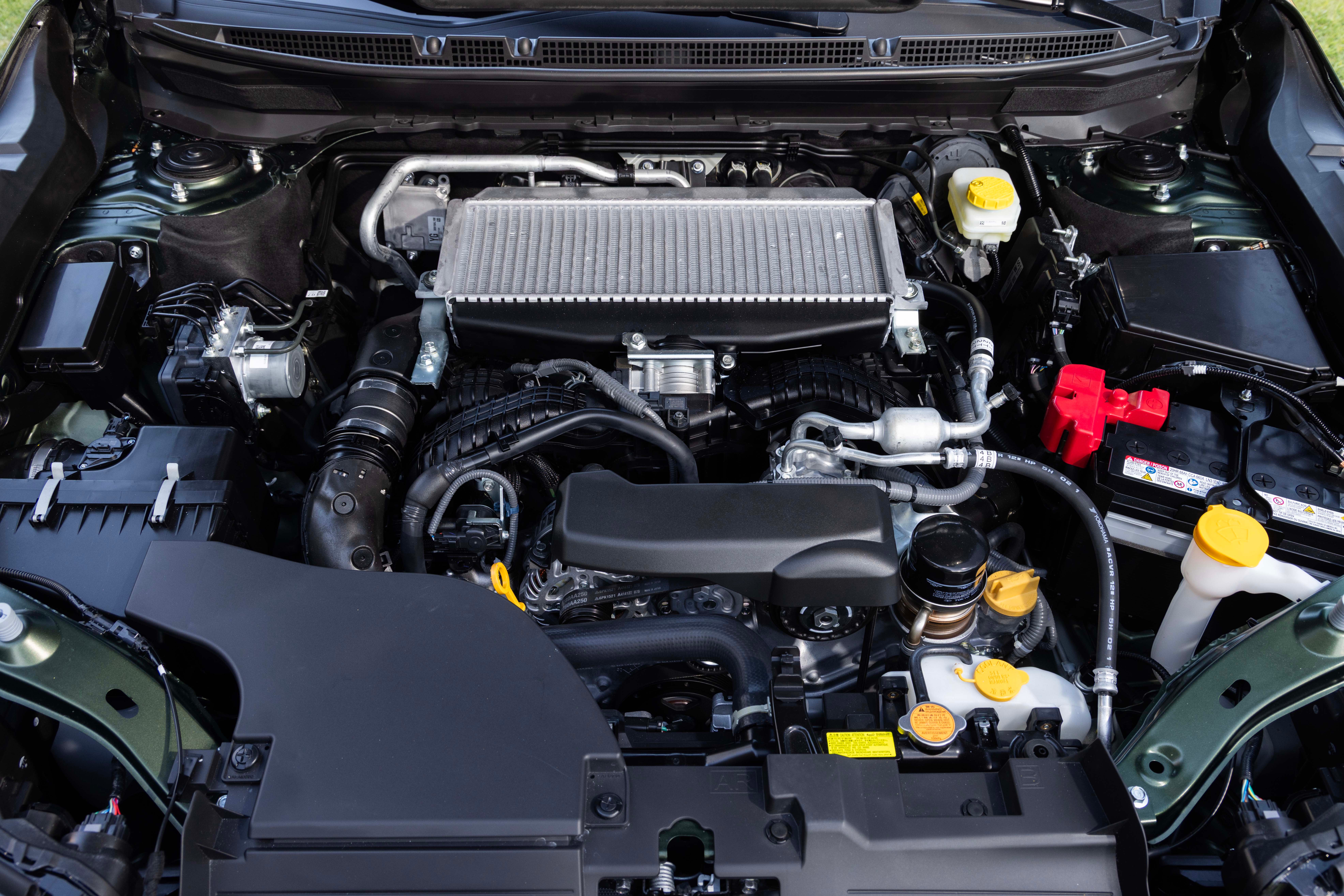 The Subaru Outback engine bay with the hood open, showing the BOXER engine and the intercooler mounted on top