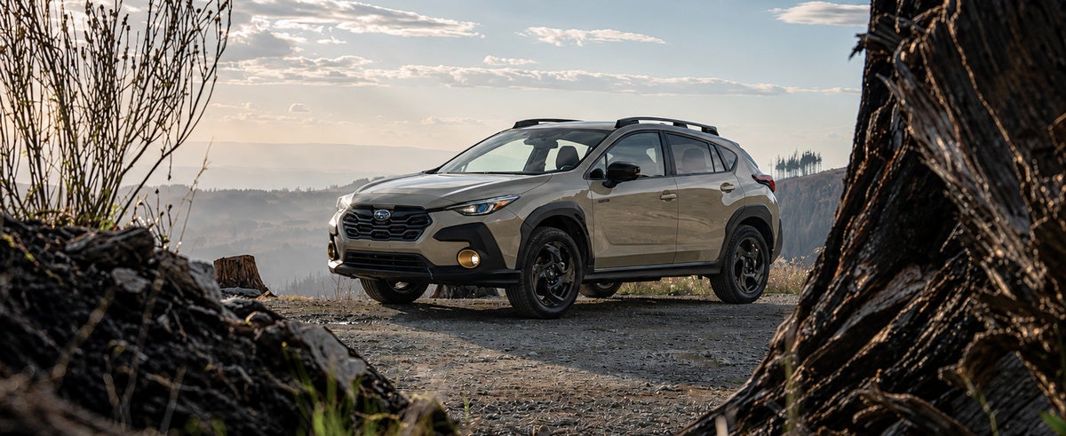 A Subaru Crosstrek parked on a ridge at golden hour, one of the models that turns up used and Certified Pre-Owned at Dalton Subaru National City